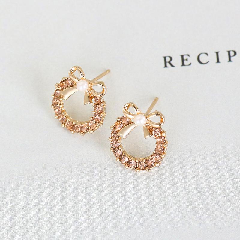 Pearl bow metal stud earrings