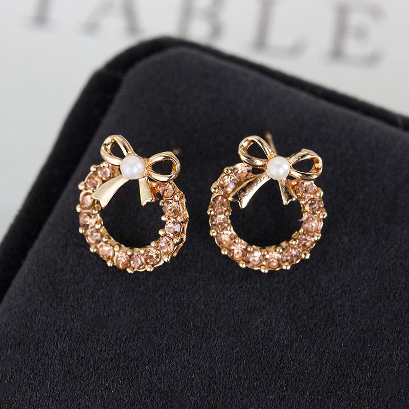 Pearl bow metal stud earrings