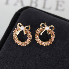 Pearl bow metal stud earrings